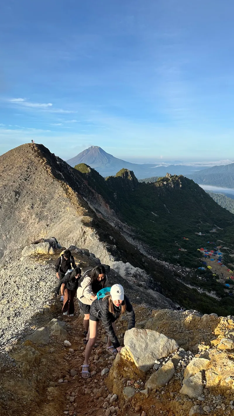 A guided group ascending the Mount Sibayak ridge trail